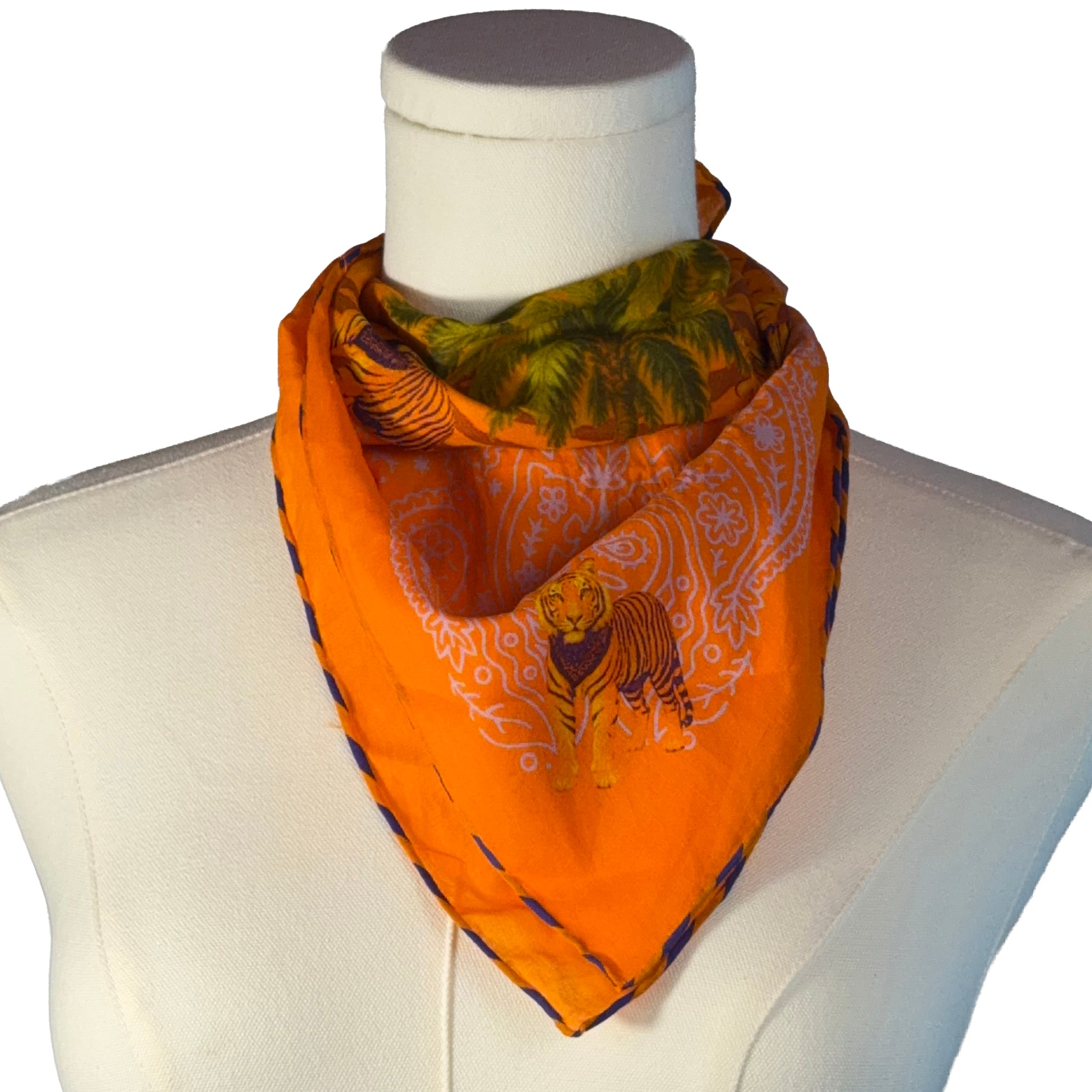 Orange scarf with tiger design on a mannequin